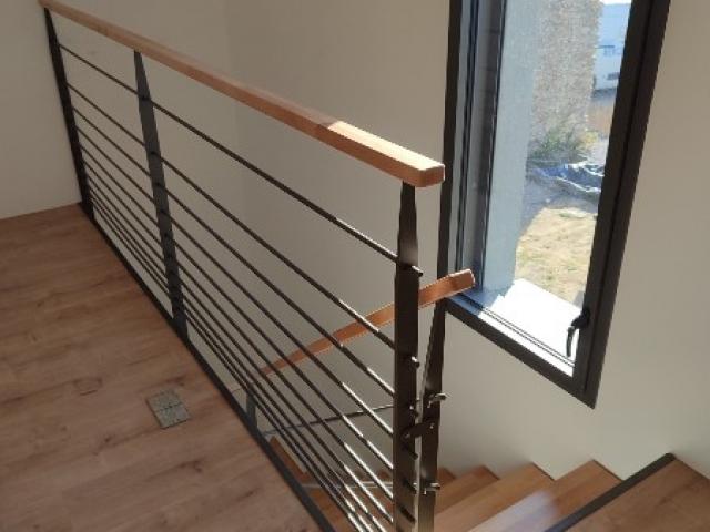 Réalisation d'un escalier quart tournant avec ses garde-corps métal bois à Champtoceaux